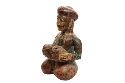 Lot 227 - A CARVED AND PAINTED WOODEN FIGURE OF A RAJASTHANI TABLA DRUMMER