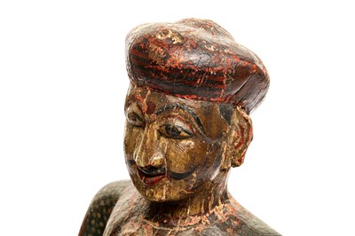 Lot 227 - A CARVED AND PAINTED WOODEN FIGURE OF A RAJASTHANI TABLA DRUMMER