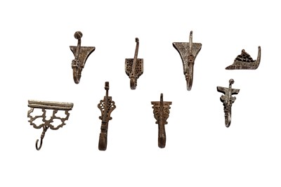 Lot 331 - A GROUP OF SIX PERSIAN STEEL BELT HOOKS AND TWO ACCESSORIES