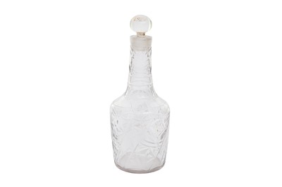 Lot 270 - A CUT AND GILT CLEAR-GLASS BOTTLE WITH STOPPER