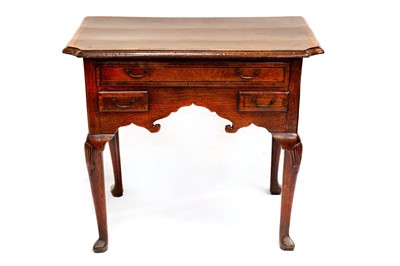Lot 724 - An early 18th Century oak and line inlaid kneehole lowboy