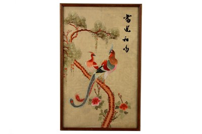Lot 192 - An Oriental silkwork panel decorated with a pair of exotic birds