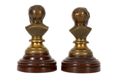 Lot 119 - A pair of late 19th/early 20th century French patinated bronze miniature busts of infants