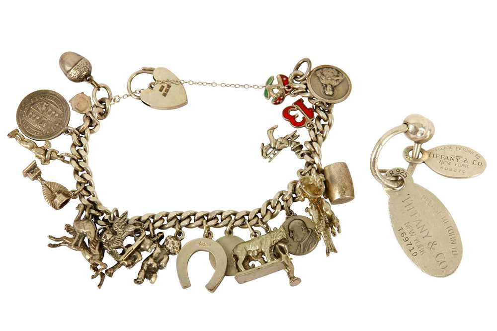 Lot 116 - A key chain by Tiffany & Co. and silver charm bracelet