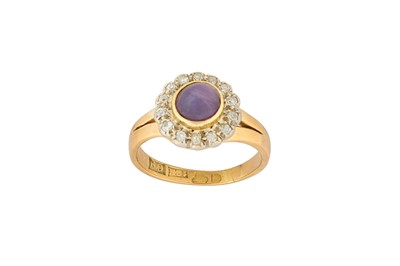Lot 13 - A purple star sapphire and diamond cluster ring, 1964