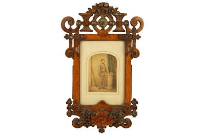 Lot 326 - A Victorian hand tinted photograph housed in a oak Gothic Revival frame