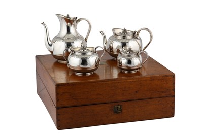 Lot 305 - A cased Victorian sterling silver four-piece tea and coffee service, London 1874/75 by Martin Hall and Co