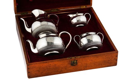 Lot 305 - A cased Victorian sterling silver four-piece tea and coffee service, London 1874/75 by Martin Hall and Co