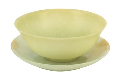 Lot 327 - A celedon jade bowl and green hardstone circular dish