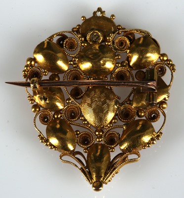 Lot 209 - A Georgian gold and pink topaz filigree brooch.