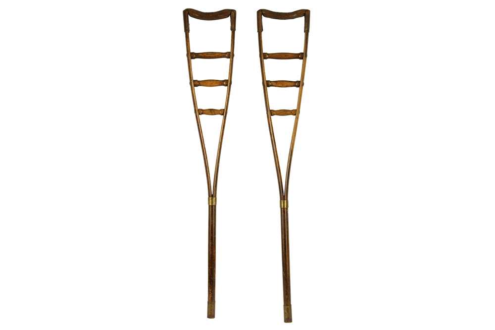 Lot 338 - A pair of Victorian era oak bent wood crutches