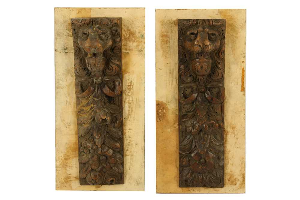 Lot 342 - A pair of 19th century carved wood lion wall plaques