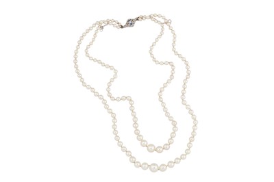 Lot 171 - A double-strand cultured pearl with a sapphire and diamond clasp
