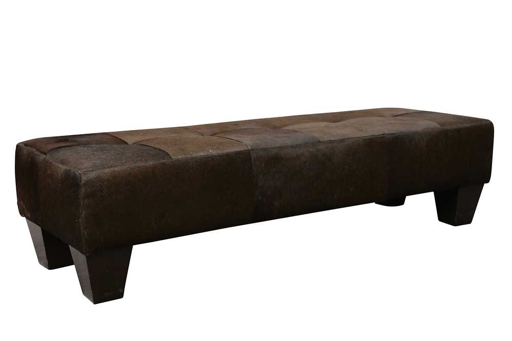Lot 739 - A contemporary cow hide upholstered stool