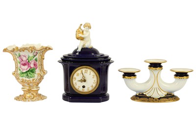 Lot 380 - An early 20th Century KPM porcelain mantel clock with going barrel