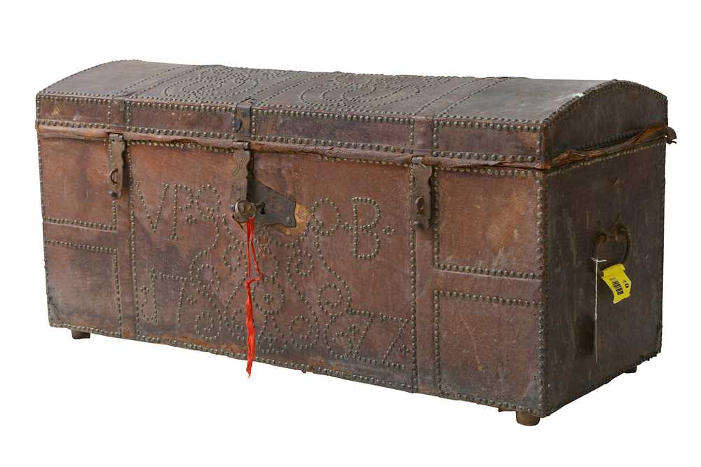 Lot 494 - An 18th Century central European leather dome top chest
