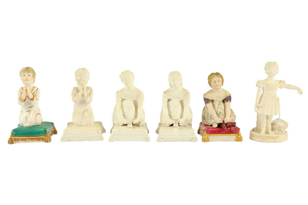 Lot 365 - A pair of mid to late 19th century European painted porcelain figures of kneeling children