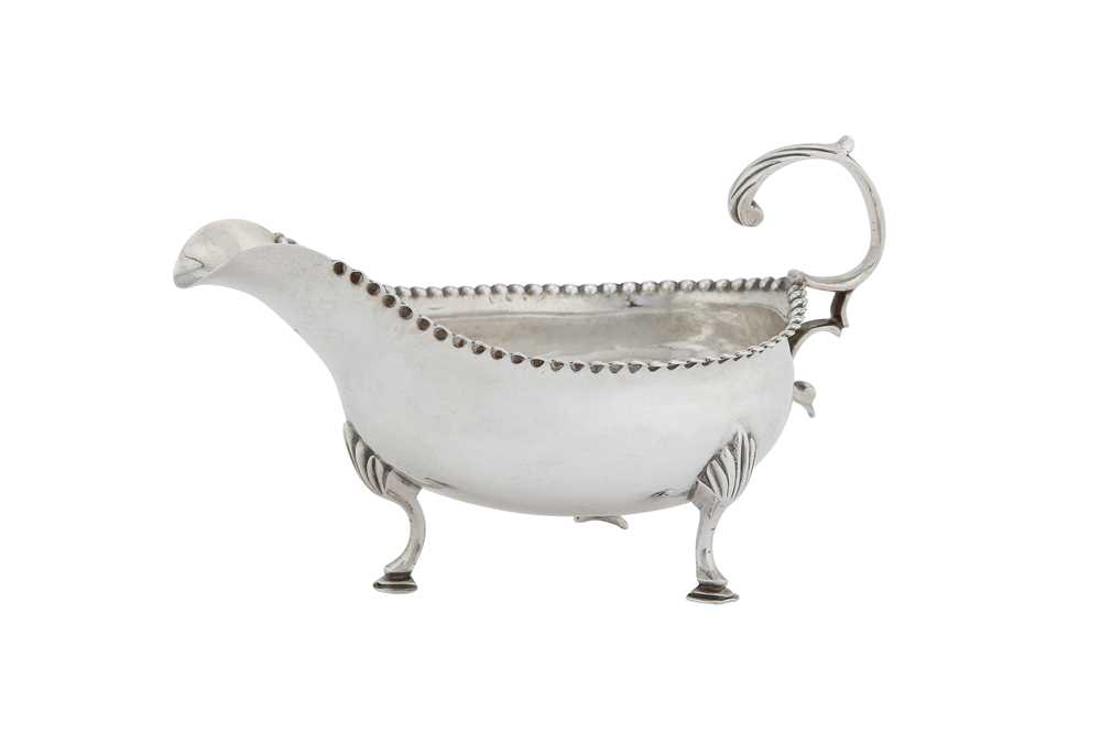 Lot 366 - A George III sterling silver sauce or cream boat, London 1788 by Hester Bateman overstruck by George Gray