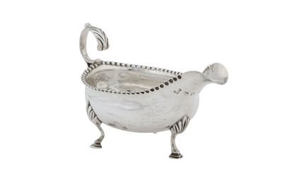 Lot 366 - A George III sterling silver sauce or cream boat, London 1788 by Hester Bateman overstruck by George Gray