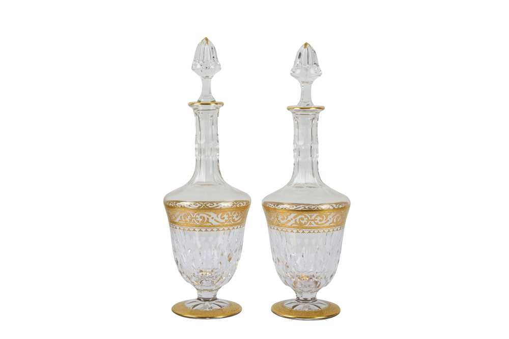 Lot 307 - Two St Louis faceted crystal decanters with gilt highlights