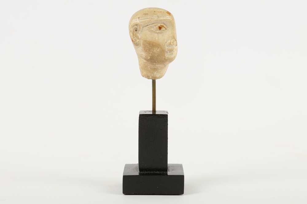 Lot 214 - AN EGYPTIAN PLASTER HEAD OF A PRIEST