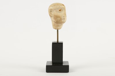 Lot 214 - AN EGYPTIAN PLASTER HEAD OF A PRIEST
