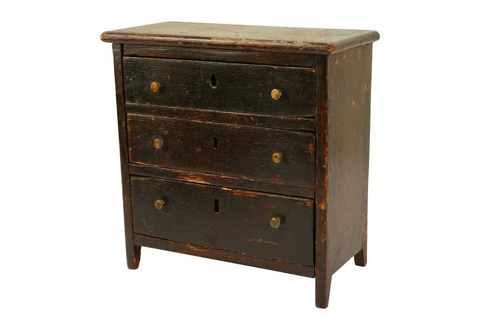 Lot 353 - A mid to late 19th century stained oak miniature or ‘apprentice’ chest of drawers, English circa 1880
