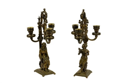 Lot 166 - A pair of late 19th century French gilt bronze candlesticks, circa 1900
