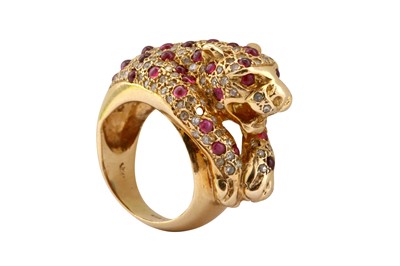 Lot 21 - A ruby and diamond dress ring
