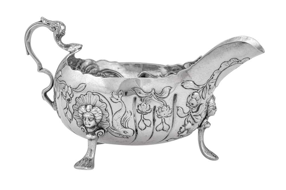 Lot 285 - A George II Irish sterling silver sauce boat, Dublin circa 1750 by Andrew Goodwin (free 1730, died 1787)