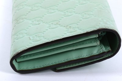 Lot 139 - Gucci Pastel Green Cat Head Continental Wallet