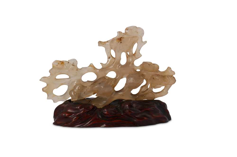 Lot 43 - A CHINESE AGATE 'BIRDS AND PINES' BRUSH REST.