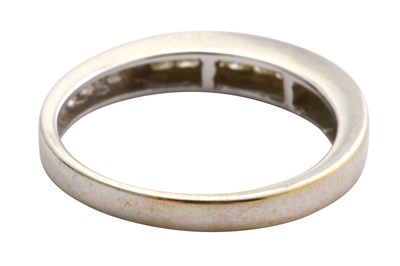 Lot 116 - A diamond half hoop ring