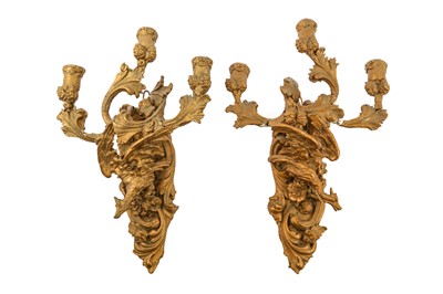 Lot 411 - A pair of 19th Century Continental gilt triple wall sconces