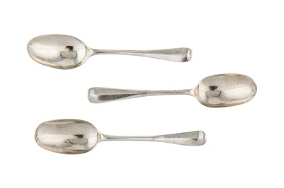 Lot 252 - A set of three George I Britannia standard silver dessert spoons, London 1717 makers mark heavily obscured, possibly George Lambe (reg. 10th June 1713)
