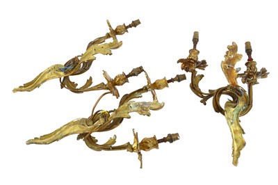 Lot 419 - A set of three early 20th Century Louis XV style cast gilt metal twin branch wall sconces