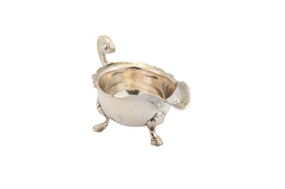 Lot 306 - A George II sterling silver cream boat, London 1734 maker mark partially obscured but certainly for David Willaume II (reg. 2nd April 1728)
