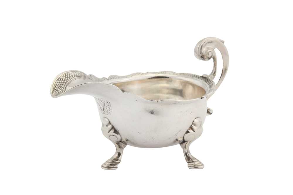 Lot 306 - A George II sterling silver cream boat, London 1734 maker mark partially obscured but certainly for David Willaume II (reg. 2nd April 1728)
