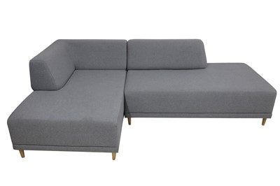Lot 125 - A contemporary corner sofa upholstered in grey fabric