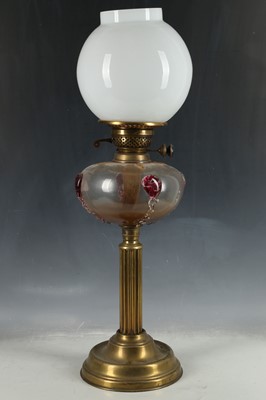 Lot 535 - A brass oil lamp with opaque glass shade over...