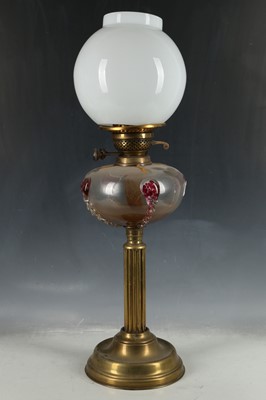 Lot 535 - A brass oil lamp with opaque glass shade over...