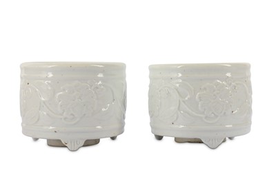 Lot 26 - A PAIR OF WHITE-GLAZED 'HIBISCUS' INCENSE BURNERS.