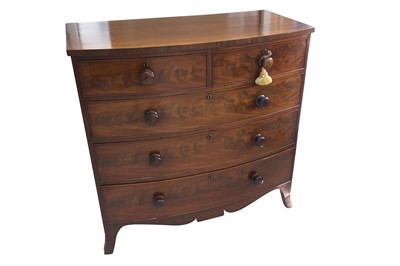 Lot 452 - A mid 19th Century bow fronted flame mahogany chest