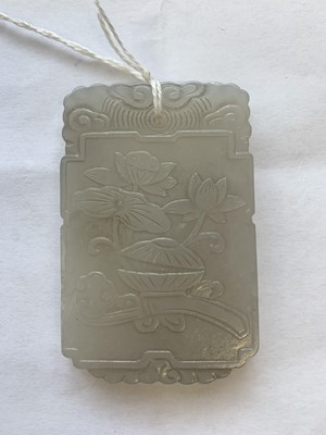 Lot 429 - A CHINESE WHITE JADE 'LOTUS' PLAQUE.