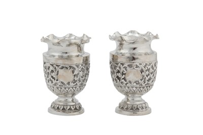 Lot 123 - A pair of early 20th century Anglo – Indian Raj unmarked silver vases, Cutch circa 1900