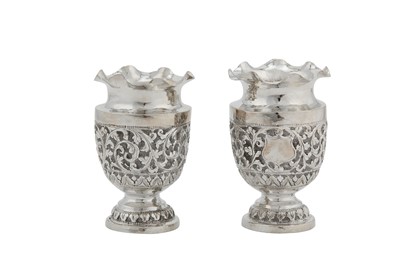 Lot 123 - A pair of early 20th century Anglo – Indian Raj unmarked silver vases, Cutch circa 1900