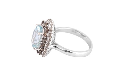 Lot 32 - An aquamarine and diamond cluster ring