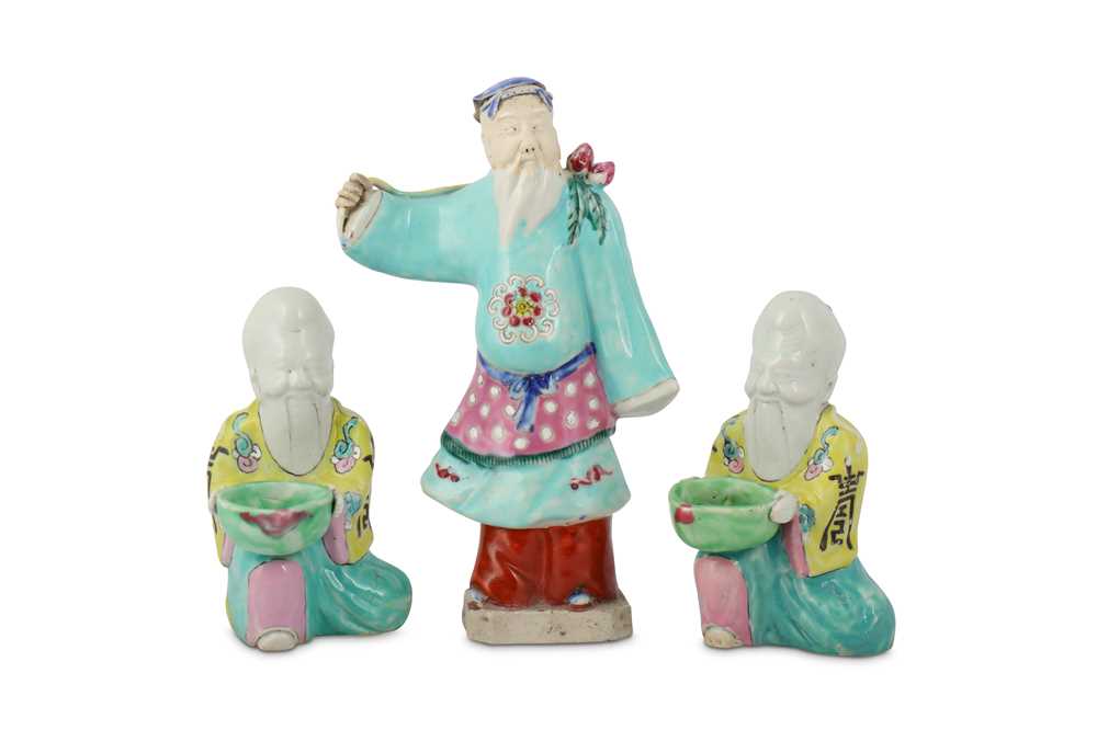 Lot 394 - THREE CHINESE FAMILLE ROSE FIGURES OF IMMORTALS.
