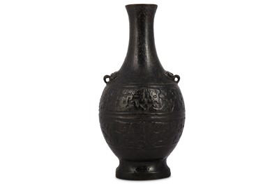 Lot 262 - A CHINESE BRONZE TWIN HANDLED VASE.