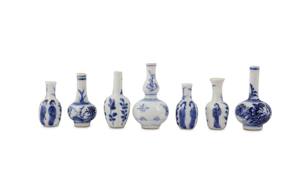 Lot 552 - SEVEN CHINESE BLUE AND WHITE MINIATURE VASES.